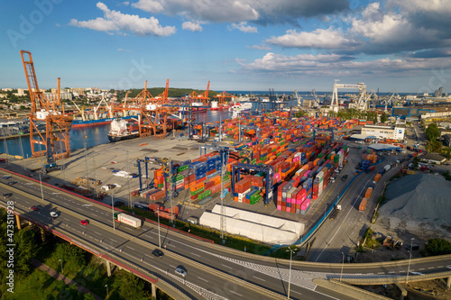 Port of Gdynia. Seaport  containers  container ships and sea transport from the bird s eye view on a sunny day.