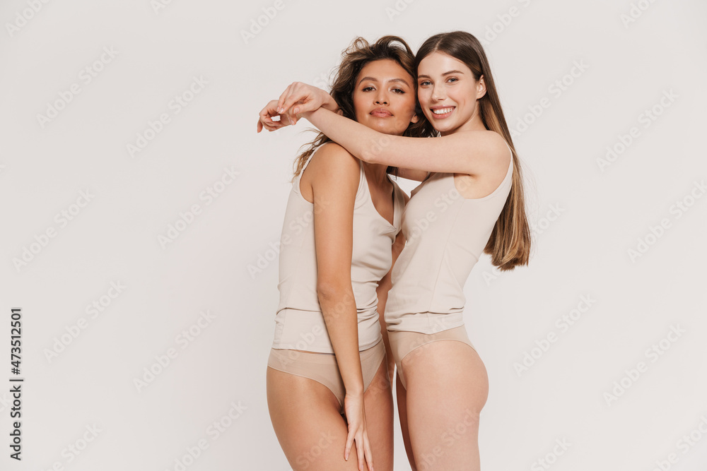 Two young woman in underwear standing Two young woman in underwear standing
