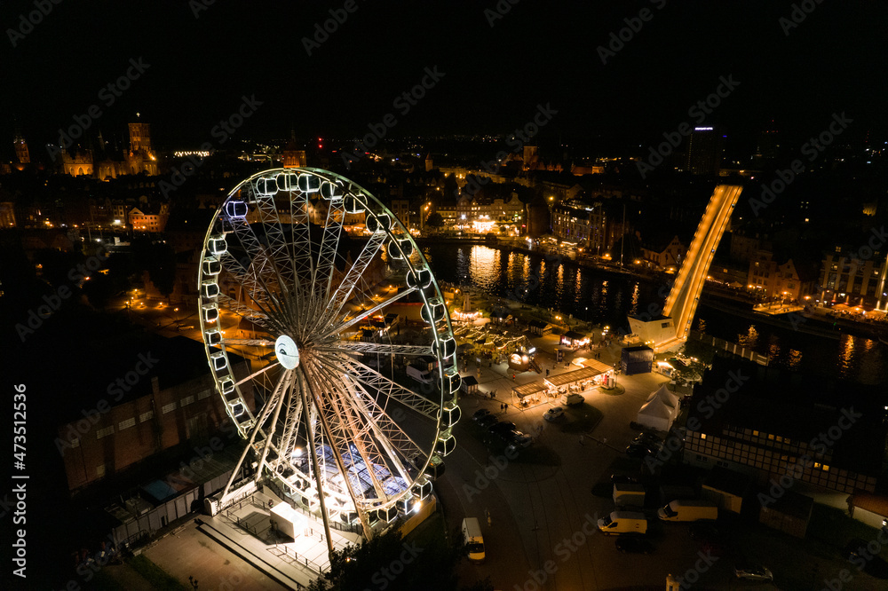 Gdańsk at night. Beautiful city on the Baltic Sea at night from drone flight.