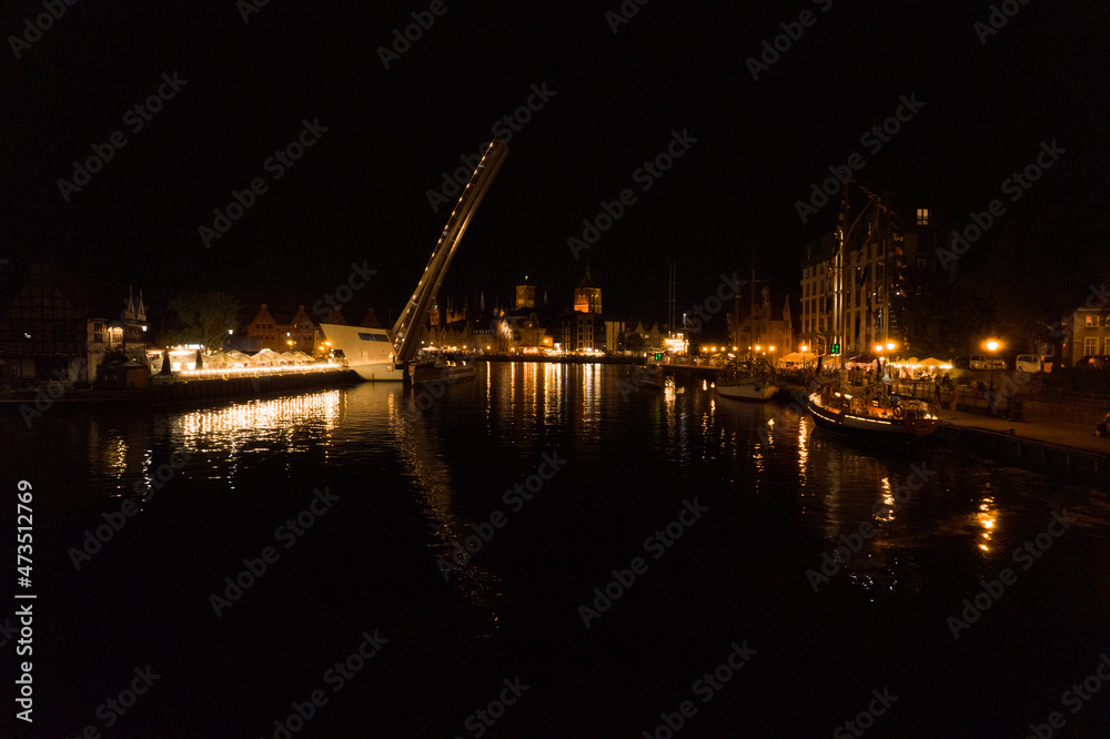 Gdańsk at night. Beautiful city on the Baltic Sea at night from drone flight.