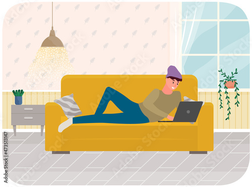 Distance learning, freelance and internet job. Man lying with laptop on couch at home. Remote work, online home freelancing, entertainment. Online communication, internet surfing in living room