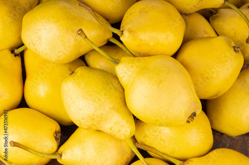heap of fresh yellow pears background