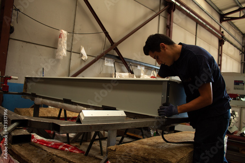 worker putting insulation on skylights