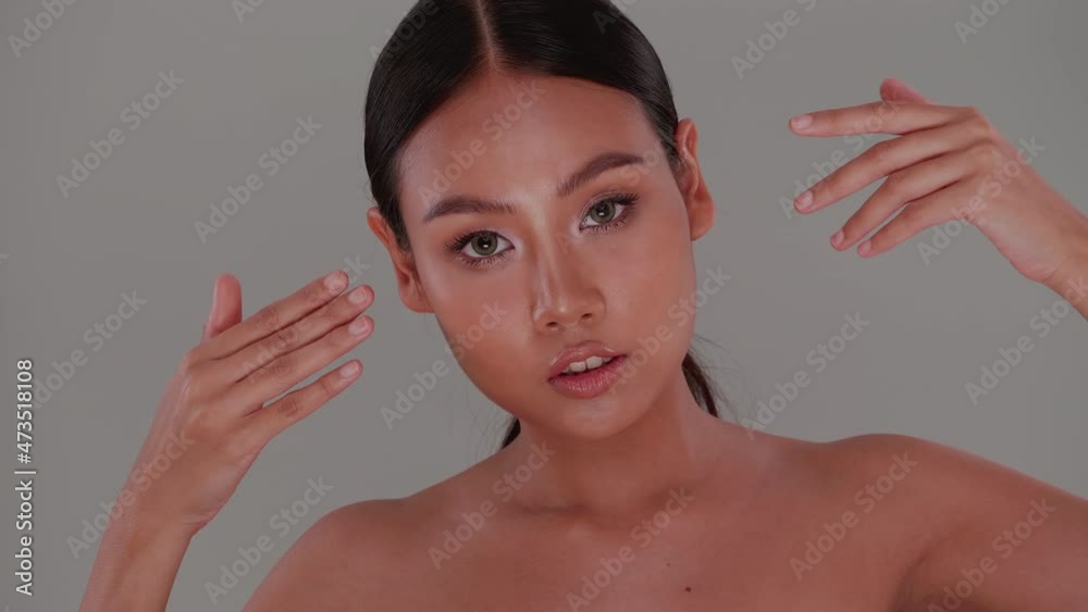 Beautiful face of Asian young woman with natural skin. Portrait of attractive girl with soft make-up and tanned skin. Beautiful face of Asian young woman with natural skin. Portrait of attractive girl with soft make-up and tanned skin.