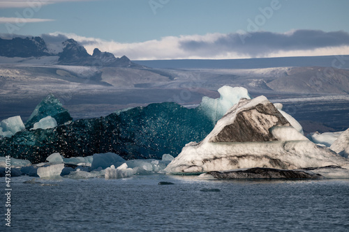 Huge deep blue iceberg swimming in Jökulsárlón glacier lake on iceland