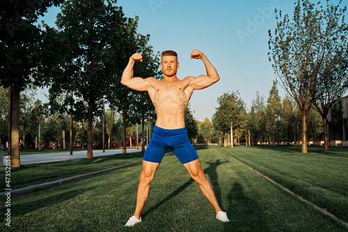 sporty man workout in park crossfit exercise summer © VICHIZH