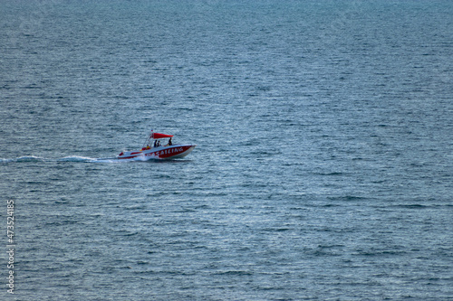 A boat floats in the sea close-up.