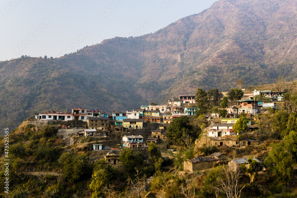  A wide angle shot of a village in the mountains in northern India.