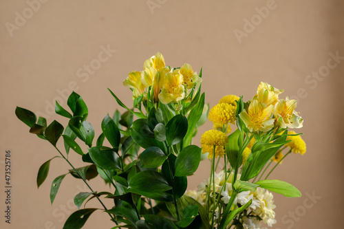 Bouquet of random flowers in a vase. Bouquet of yellow lilies, c