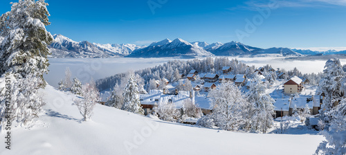 Laye winter ski resort covered in fresh snow with panoramic view of the mountains of Ecrins National Park. Champsaur valley in the French Alps. Hautes-Alpes, France © Francois Roux