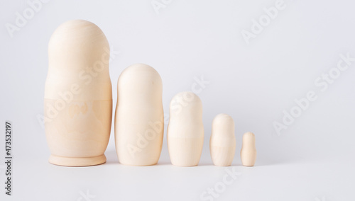 children's toy wooden matryoshka on a white background