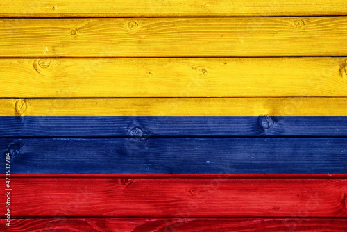 Flag of Colombia on wooden surface 