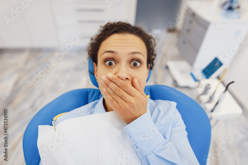 Afraid woman sitting in dental chair
