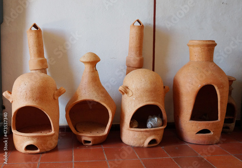 The clay stoves are typical of the town of Raquira, Boyaca, Colombia. Here you can also see a piggy bank hidden in one of these ovens. photo