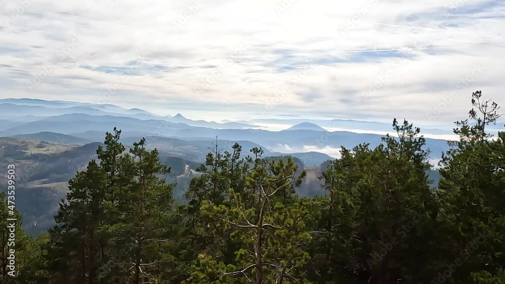 Misty mountain landscape. Beautiful nature, landscape panorama view of foggy peaks. Autumn season. Day light. Misty mountain landscape. Beautiful nature, landscape panorama view of foggy peaks. Autumn season. Day light.