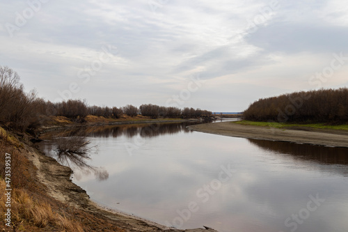 Autumn landscape of the river and sky.