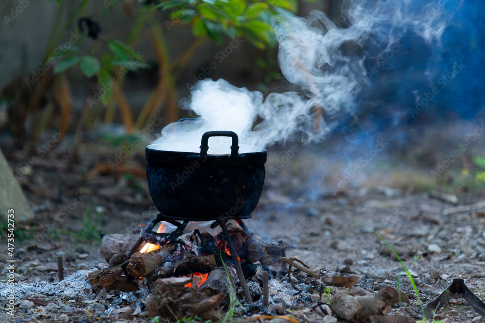 Cooking pot on a wood stove in the Asian countryside Stock Photo | Adobe  Stock
