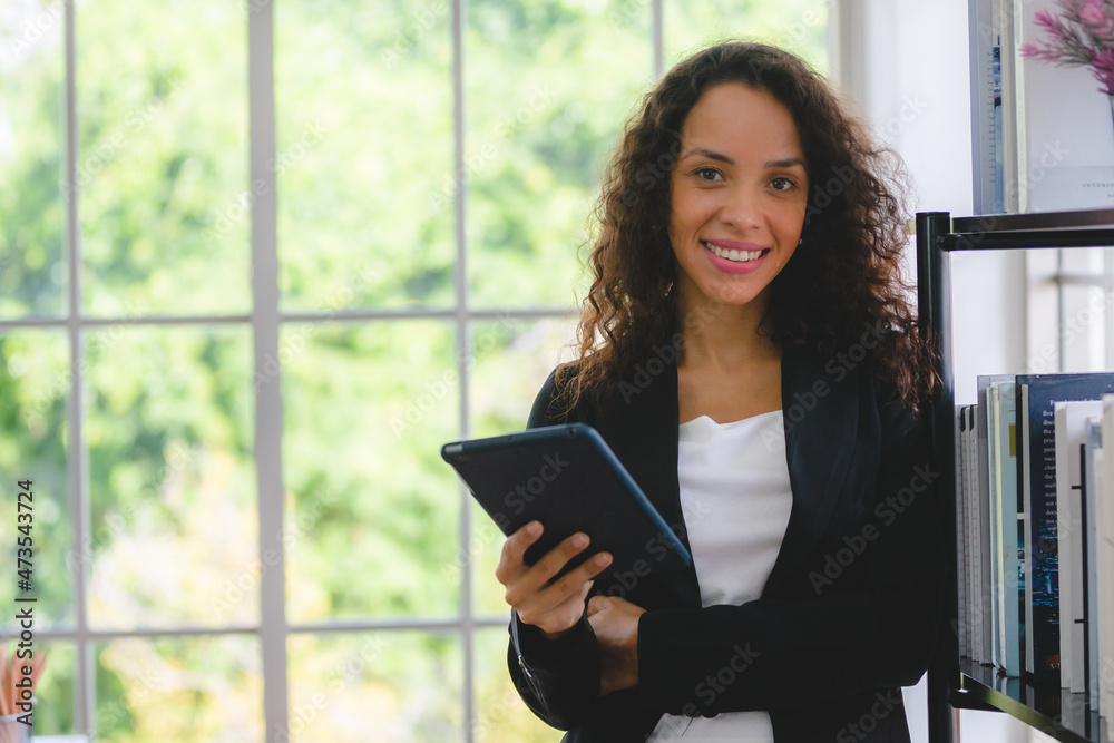 African American business woman in the modern office, professional businesswoman are happy with work African American business woman in the modern office, professional businesswoman are happy with work