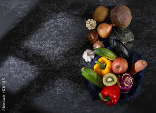 Vegetable ingredients on cement background