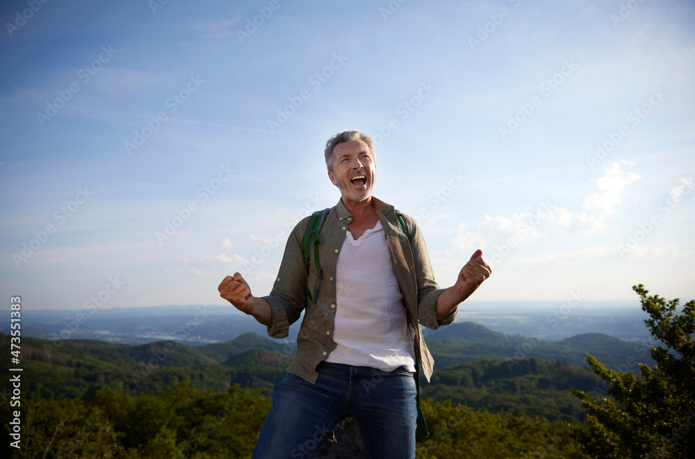 Excited man gesturing fist while screaming Excited man gesturing fist while screaming