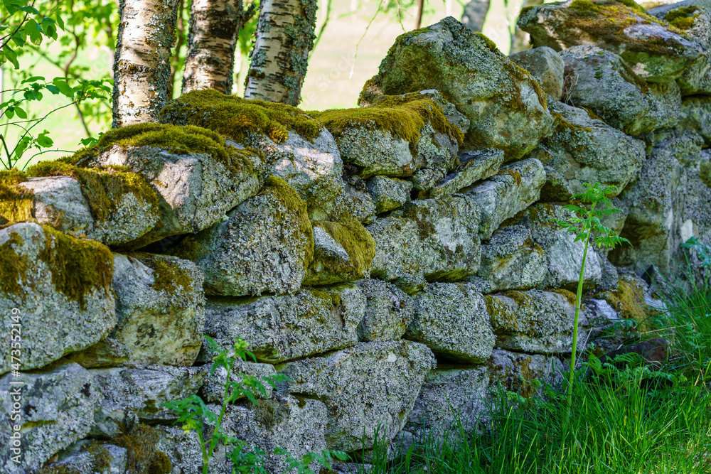 Dry stone wall with moss in the nature. Dry stone wall with moss in the nature.