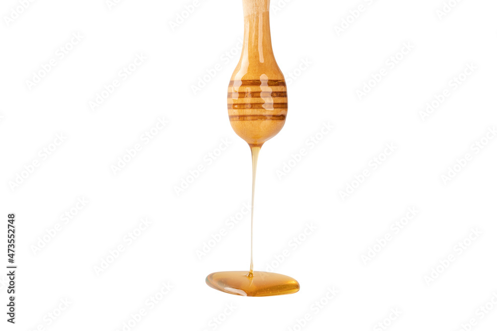 Honey dripping from honey dipper isolated on white background. Honey dripping from honey dipper isolated on white background.