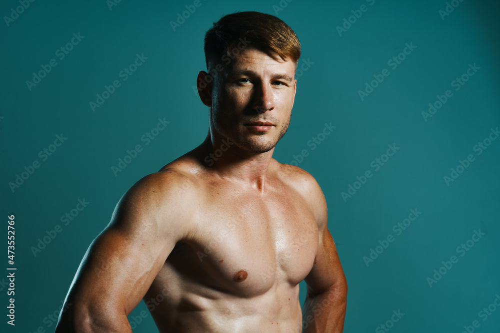 athletic man with pumped up muscular body workout green background athletic man with pumped up muscular body workout green background