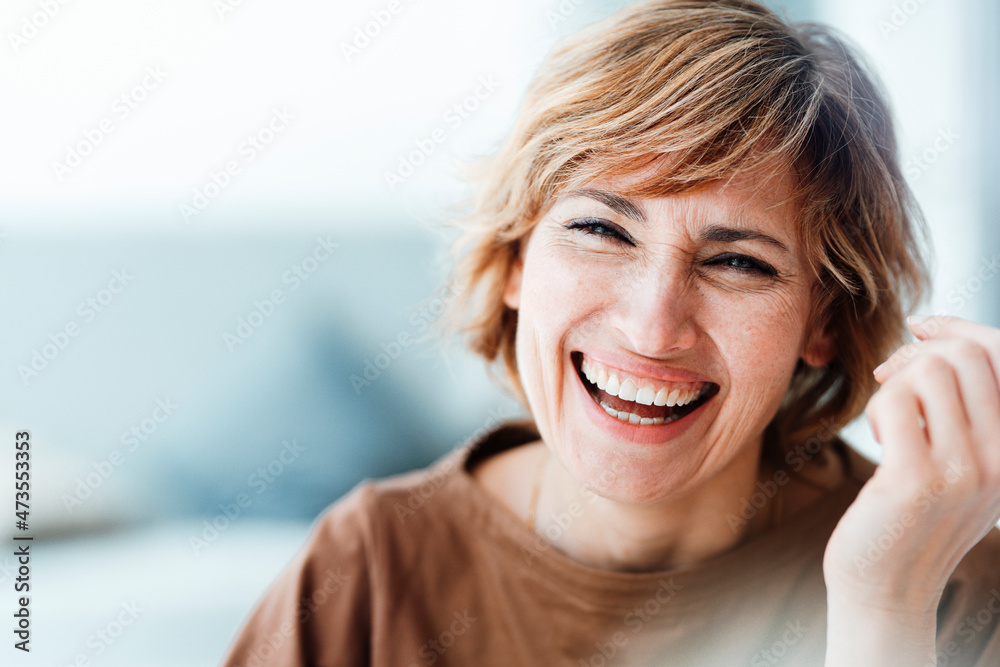 Businesswoman laughing in office Businesswoman laughing in office