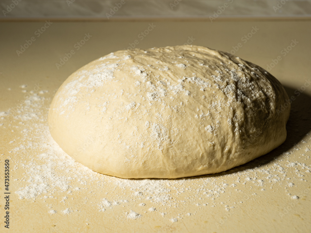 a piece of dough prepared for baking bread or cake a piece of dough prepared for baking bread or cake