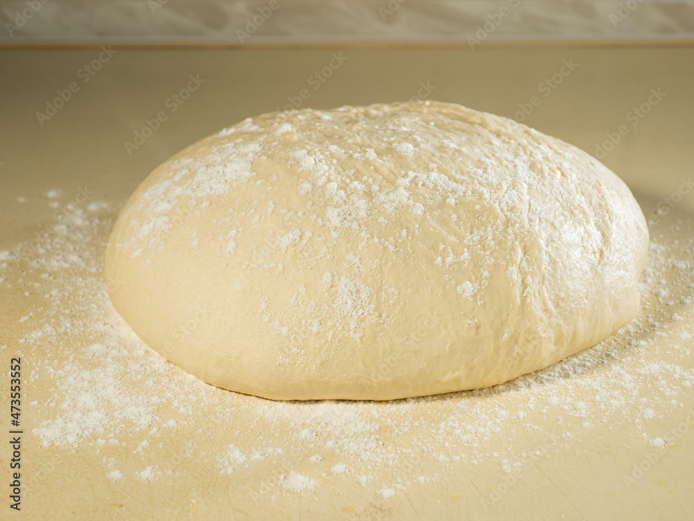 a piece of dough prepared for baking bread or cake a piece of dough prepared for baking bread or cake