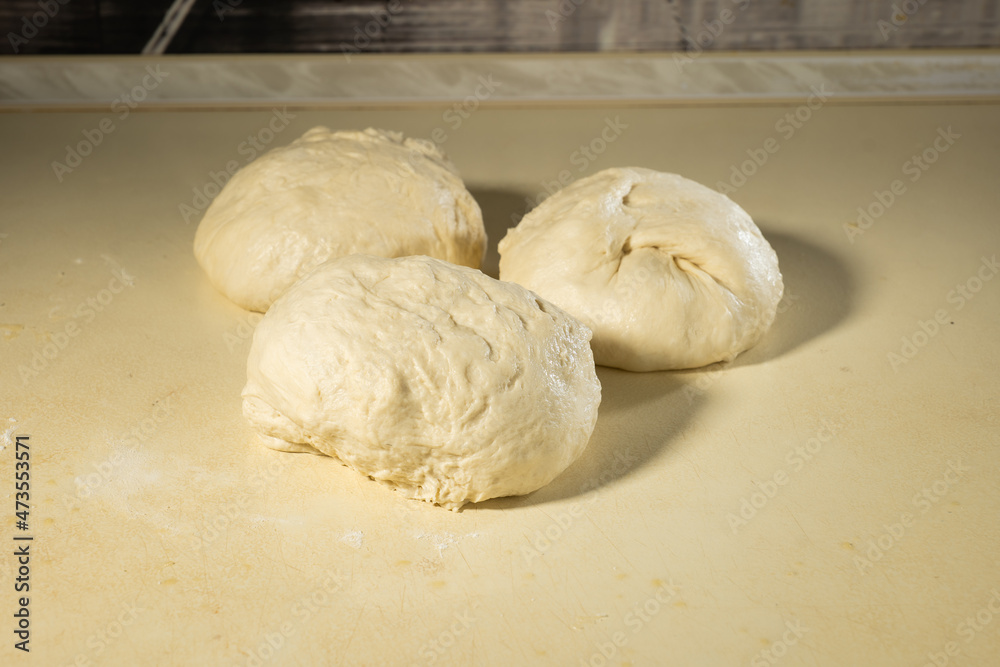 a piece of dough prepared for baking bread or cake a piece of dough prepared for baking bread or cake