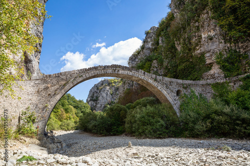 Greece, Epirus, Zagori, Old arch bridge inVikos-AoosNational Park during summer photo