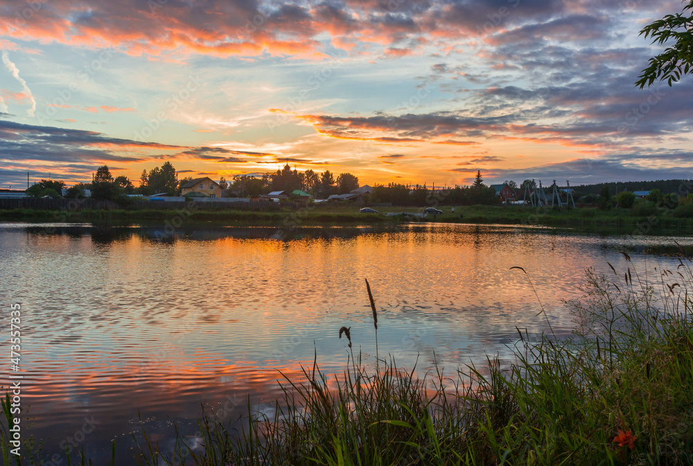 Naklejka premium sunset over the river