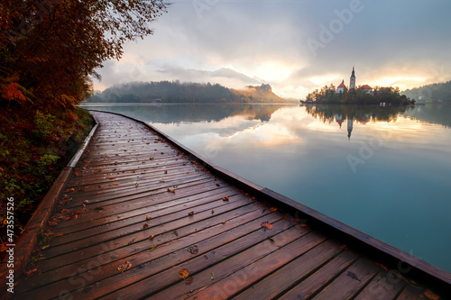 Autumn misty landscape at Lake Bled, in the middle of the lake with the church on it, in the Julian Alps, Triglav National Park