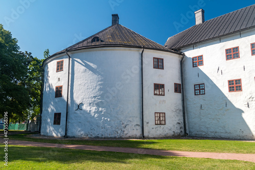 Turku Castle's bailey. Round brick tower and wall of the historic medieval Turku castle in Finland. photo