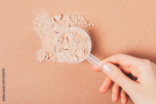 Close-up chocolate whey protein powder sports supplement photo