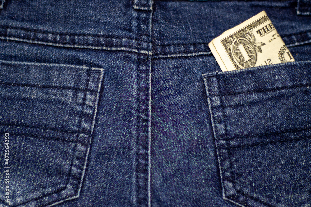 one dollar bill in front of kid child boy face cover eyes or mouth.dollars banknote in blue jeans pants pocket or isolated gray paper.financial education in school,money savings investment loans one dollar bill in front of kid child boy face cover eyes or mouth.dollars banknote in blue jeans pants pocket or isolated gray paper.financial education in school,money savings investment loans