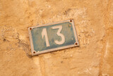 Number Thirteen on Stone Wall