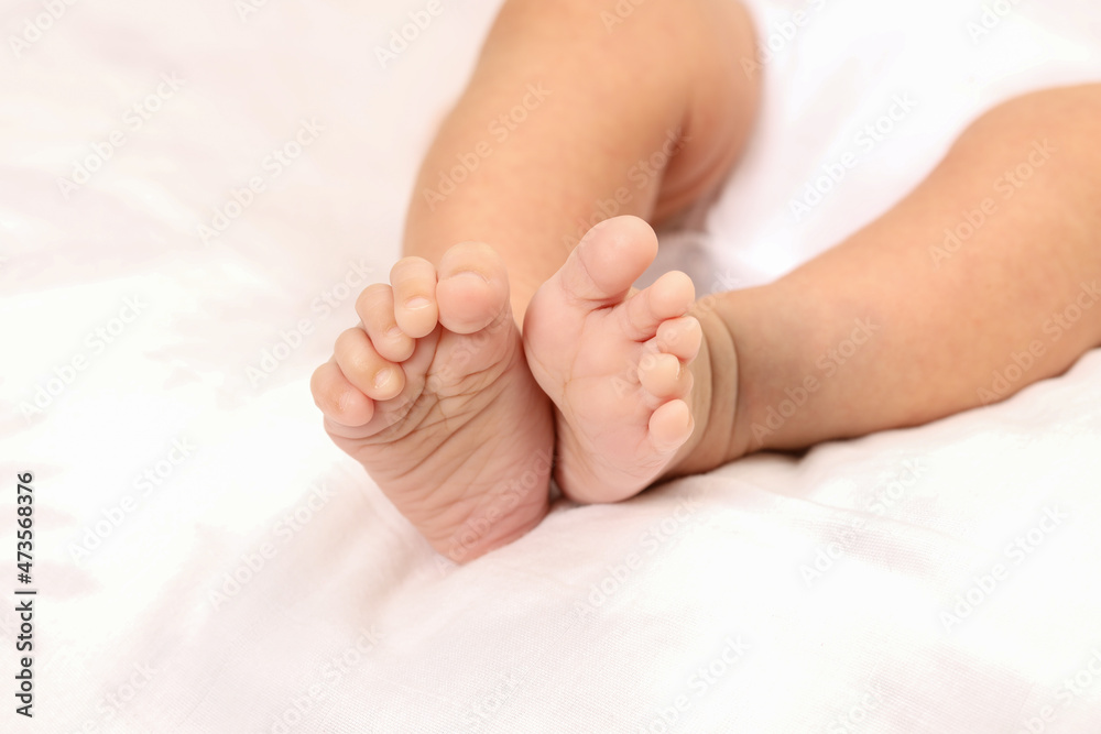 Cute little baby lying on bed, space for text. Banner design Cute little baby lying on bed, space for text. Banner design
