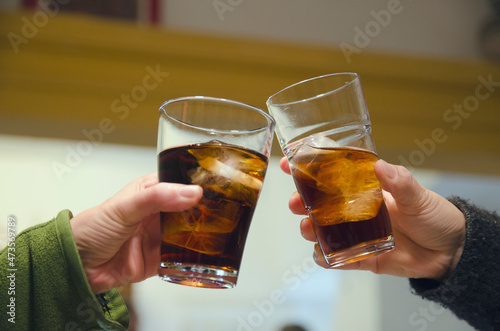 Couple glasses refreshing cold cola indoors