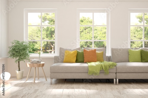 White living room with sofa and summer landscape in window. Scandinavian interior design. 3D illustration