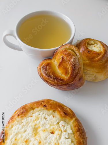 Cup of tea and croissant. Cup of hot tea with delicious buns for tea party on cold morning