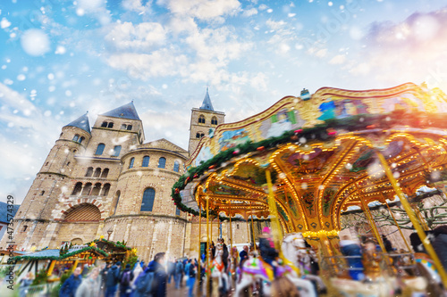 trier - colorful christmas market in winter with snowfall