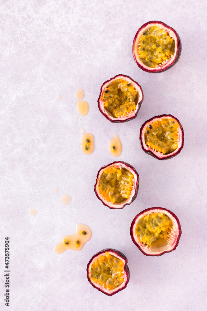 Flat lay of Passion Fruit on Pastel Purple Background with Copy Space