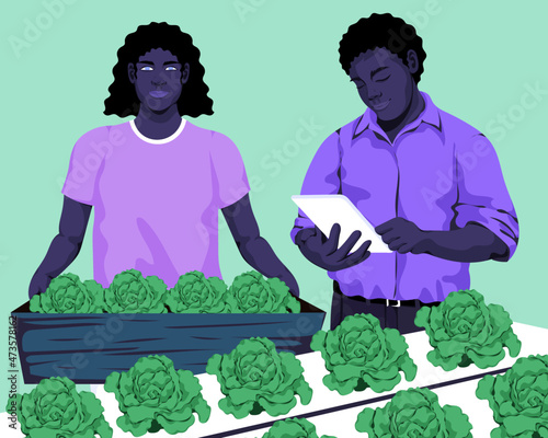 Two people working with tech on agricultural business
