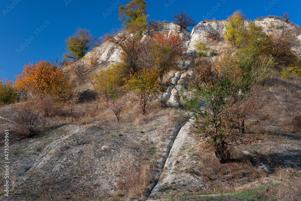 landscape of autumn trees mountains on a background of blue sky golden autumn cold often turns into snow, and then again come warm sunny days. landscape of autumn trees mountains on a background of blue sky golden autumn cold often turns into snow, and then again come warm sunny days.