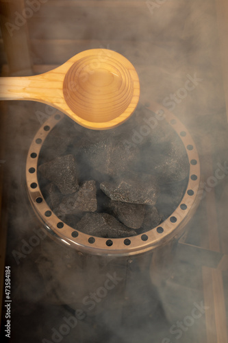 Sauna stones, steam on the stones in the sauna, wellness concept, hot relax, selective focus