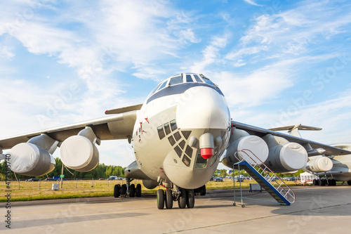 Heavy military transport aircraft at the airfield parking.