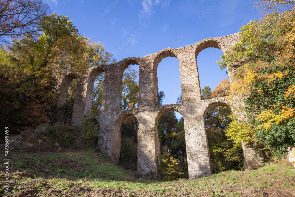 Ruins of Roman Aqueduct located in Ancient Monterano,Canale Monterano,Italy.With the great beauty among natural environment surrounding,still good preserves the traces of the past.View from front