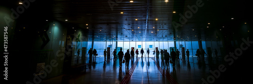 Inside view of train station with traveler people in silhouette. Concept of travel activity in banner header side image